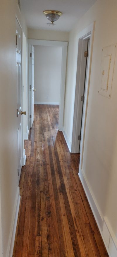 Hallway with hardwood floors