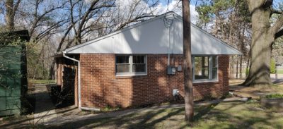Wide view of the house and side yard