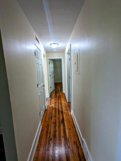 Hallway with refinished hardwood floors