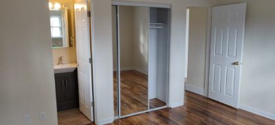 Bedroom with mirrored closet doors