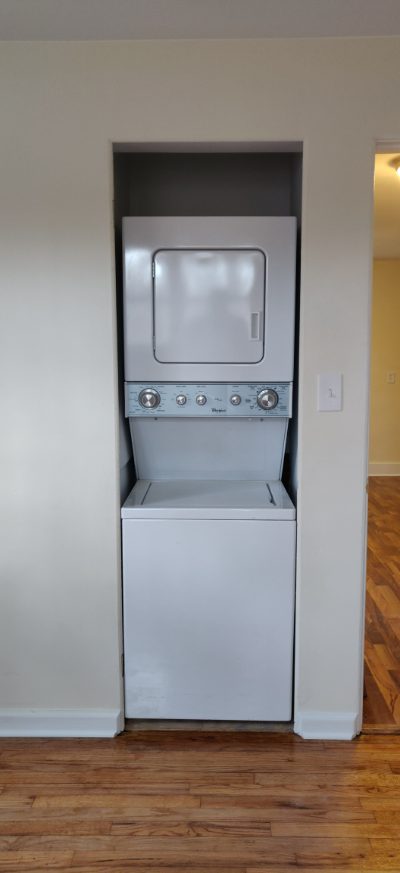 Stacked washer and dryer, included with the house